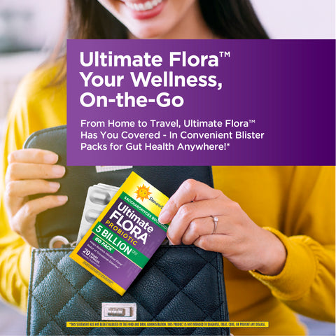 View 5 A woman places an Ultimate Flora Probiotic 20 Vegan Capsules blister pack into her black quilted handbag.